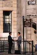 Men Talking at Bank Station